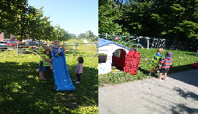 Das Bild zeigt einen eingezäunten Garten mit grüner Wiese, auf der eine blau/rote Rutsche und ein Spielhaus stehen. Kinder spielen im Garten.
